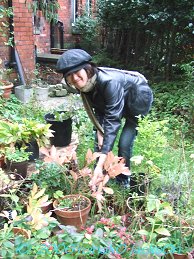 Mieko Picking wild plants from Nicole's garden